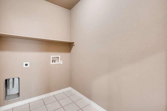 laundry area featuring hookup for a washing machine, light tile patterned floors, and hookup for an electric dryer