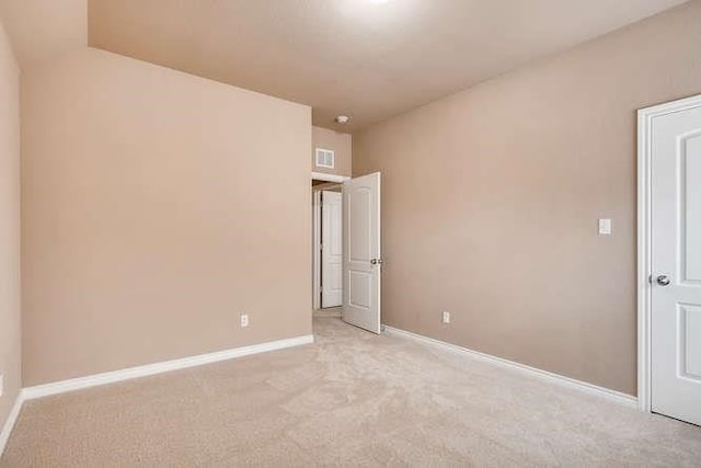 unfurnished bedroom featuring light colored carpet