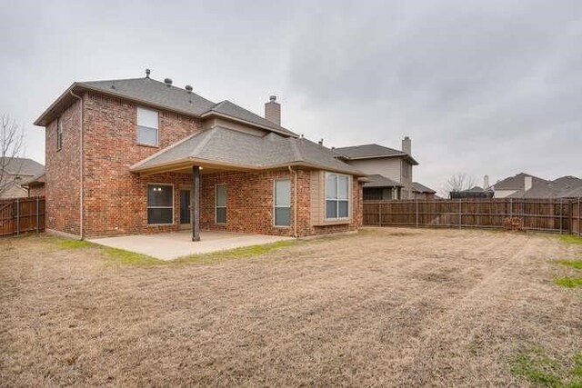 back of property featuring a patio area