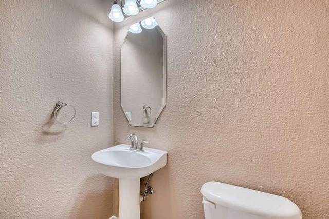 bathroom featuring toilet