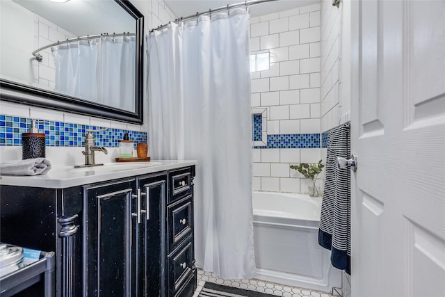 bathroom featuring tile walls, tasteful backsplash, shower / bath combo, vanity, and tile patterned floors