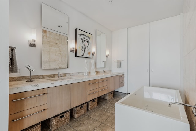 bathroom featuring vanity and a bath