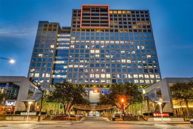 view of outdoor building at dusk