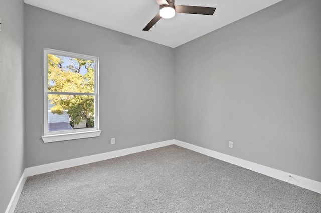 empty room featuring ceiling fan and carpet floors