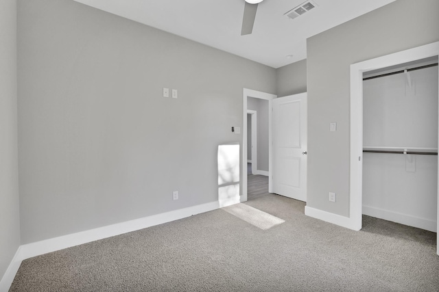 unfurnished bedroom with carpet floors, a closet, and ceiling fan