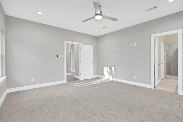 unfurnished bedroom with ensuite bathroom, ceiling fan, and light colored carpet