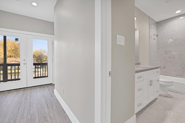 interior space featuring french doors and light hardwood / wood-style floors