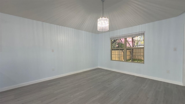 unfurnished room featuring dark hardwood / wood-style flooring