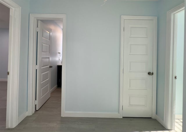 hall with light wood-type flooring