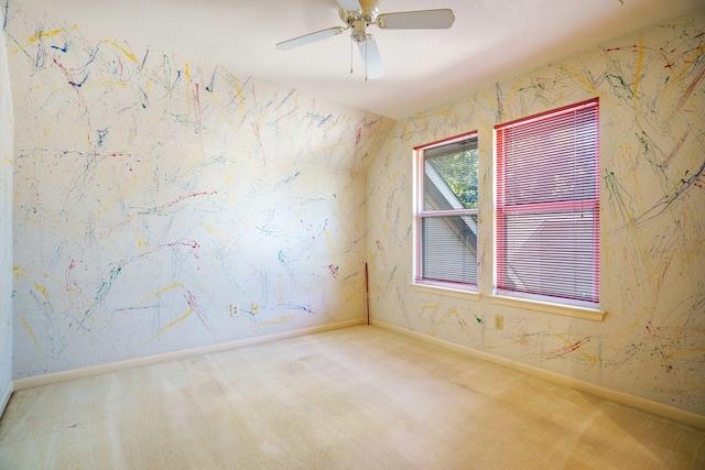 empty room featuring carpet and ceiling fan