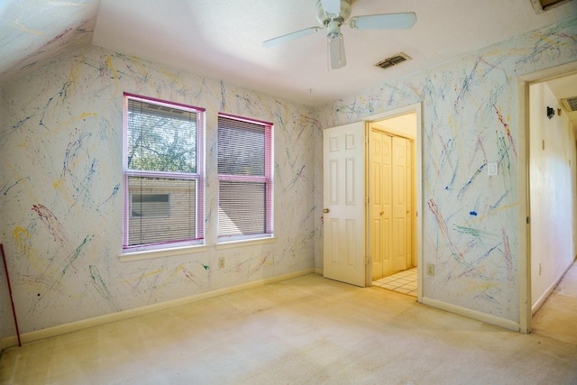 interior space featuring ceiling fan and light colored carpet