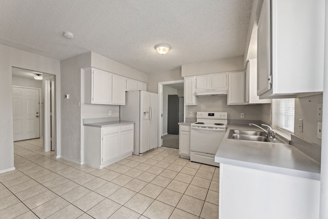 kitchen featuring a textured ceiling, white appliances, white cabinetry, and sink