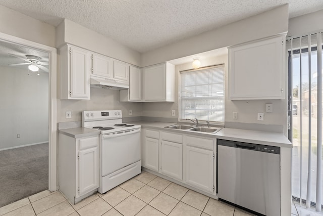 kitchen featuring dishwasher, sink, light colored carpet, electric stove, and white cabinets