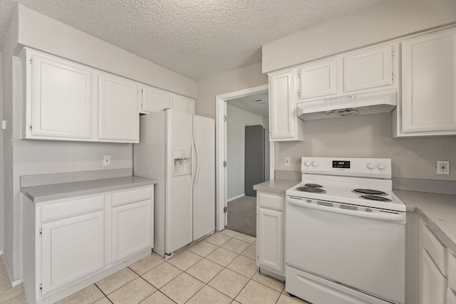 kitchen featuring white cabinets, a textured ceiling, white appliances, and light tile patterned flooring