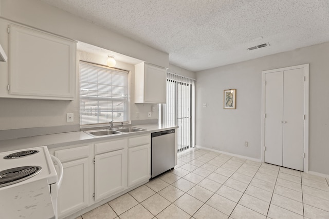 kitchen with sink, white cabinets, stainless steel dishwasher, and light tile patterned floors