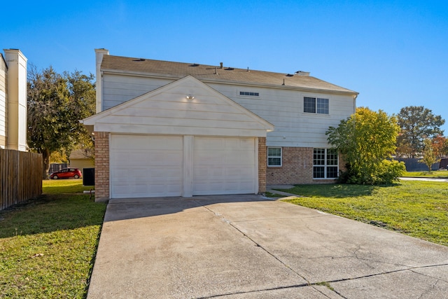 view of front of property with a garage and a front yard