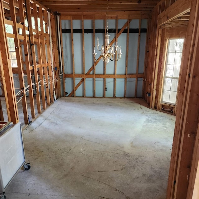 miscellaneous room with an inviting chandelier