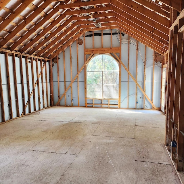 miscellaneous room with lofted ceiling