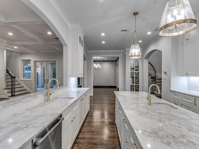 kitchen featuring dishwasher, dark hardwood / wood-style floors, white cabinetry, and sink