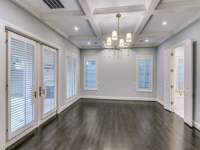 unfurnished dining area with beamed ceiling, dark hardwood / wood-style flooring, an inviting chandelier, and plenty of natural light