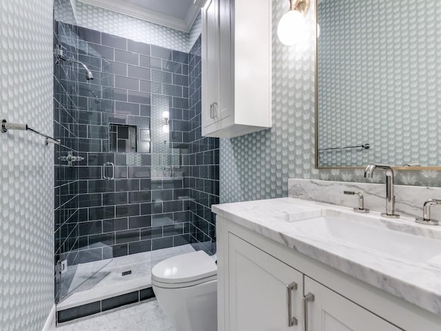 bathroom with crown molding, vanity, an enclosed shower, and toilet