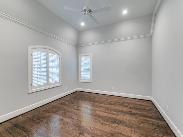 spare room with ceiling fan and dark hardwood / wood-style flooring