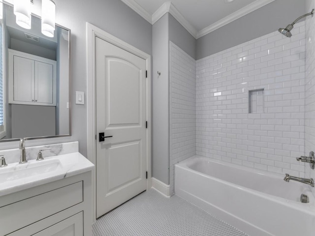 bathroom with crown molding, tile patterned flooring, vanity, and tiled shower / bath combo