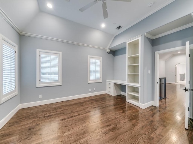 unfurnished living room featuring ceiling fan, dark hardwood / wood-style flooring, lofted ceiling, and ornamental molding