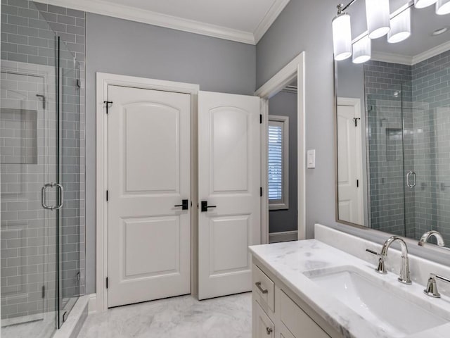 bathroom with vanity, an enclosed shower, and ornamental molding