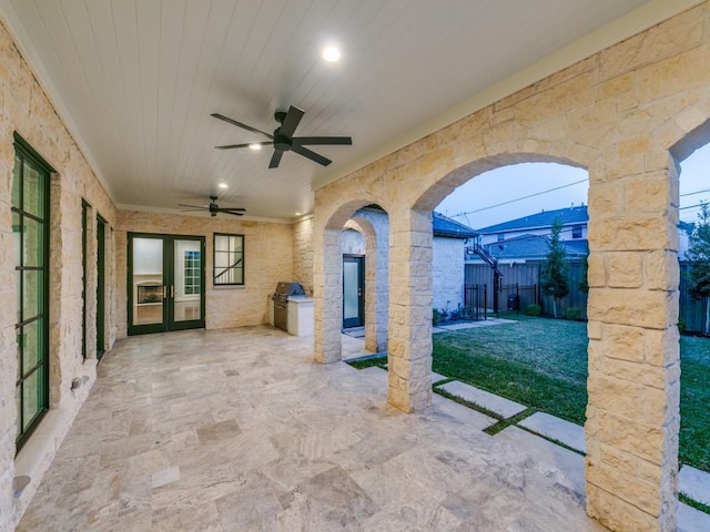 view of patio featuring ceiling fan and french doors