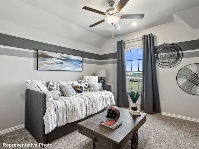 carpeted bedroom with ceiling fan and lofted ceiling