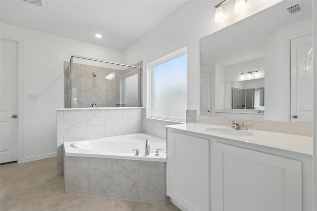 full bath featuring visible vents, vanity, a garden tub, tiled shower, and tile patterned floors
