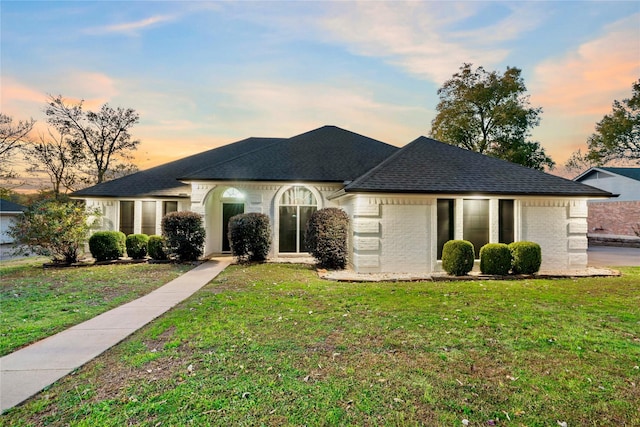 view of front of home with a yard