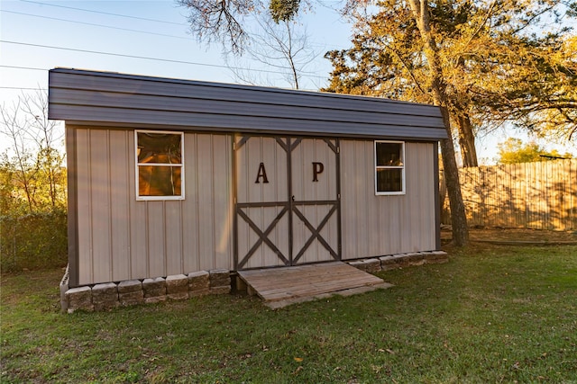 view of outbuilding featuring a yard