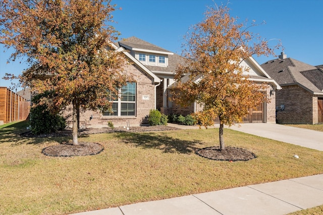 view of property hidden behind natural elements featuring a front lawn