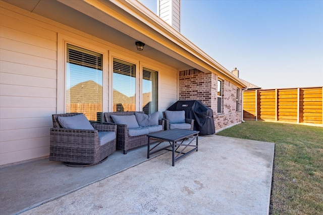 view of patio with grilling area and outdoor lounge area