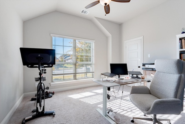 office space featuring ceiling fan, carpet floors, and lofted ceiling