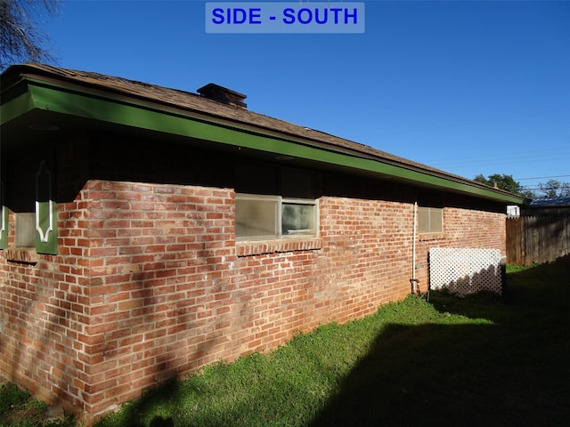 view of home's exterior with a lawn