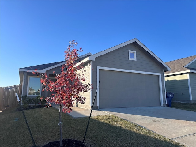 single story home with a garage and a front yard