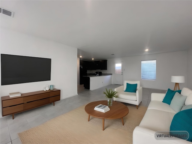 living room with light tile patterned flooring