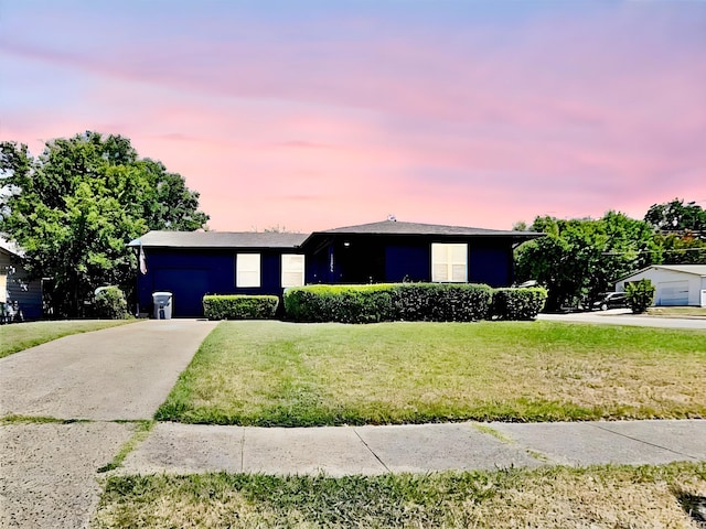 ranch-style house with a yard