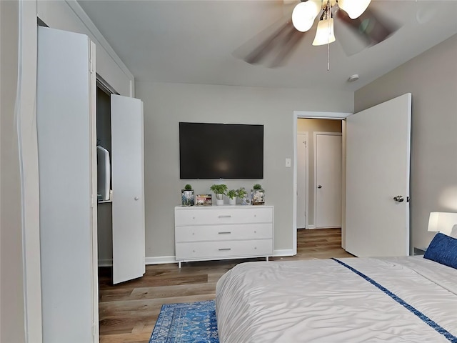 bedroom featuring ceiling fan and hardwood / wood-style floors