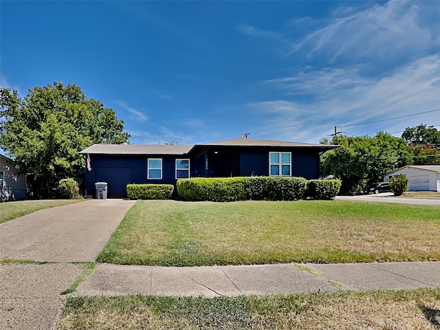 ranch-style house with a front yard and a garage