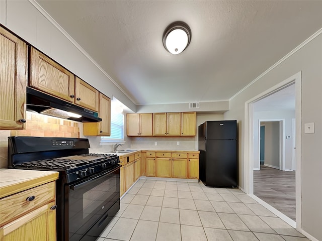 kitchen featuring sink, backsplash, ornamental molding, and black appliances