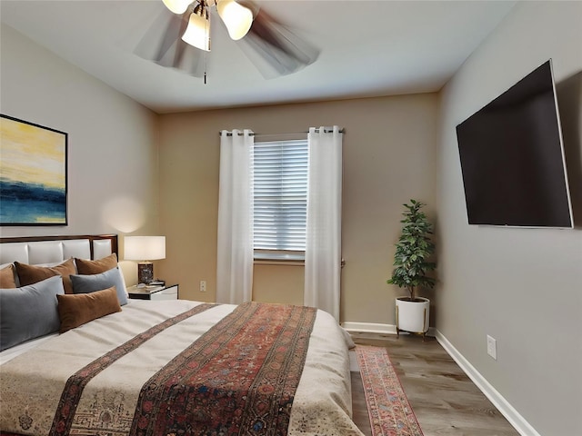 bedroom featuring ceiling fan and light hardwood / wood-style flooring