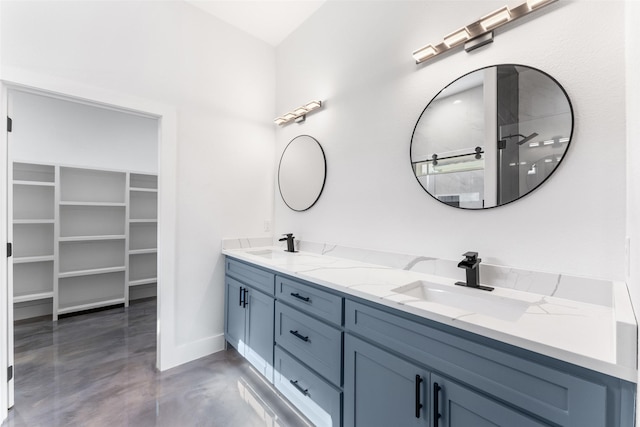 bathroom with concrete flooring and vanity