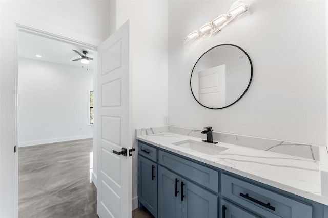 bathroom with ceiling fan and vanity