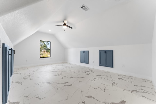 additional living space with ceiling fan and vaulted ceiling