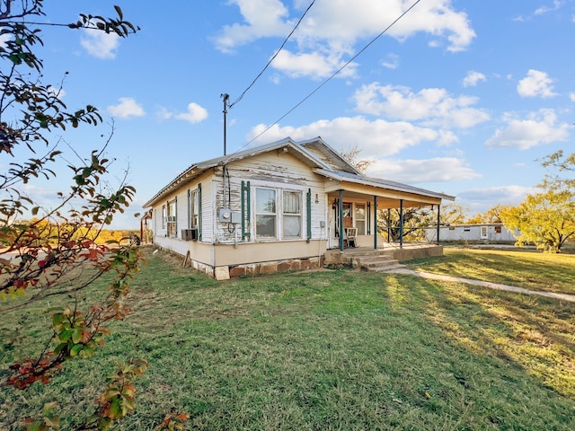 view of front of property with a porch, a front lawn, and cooling unit