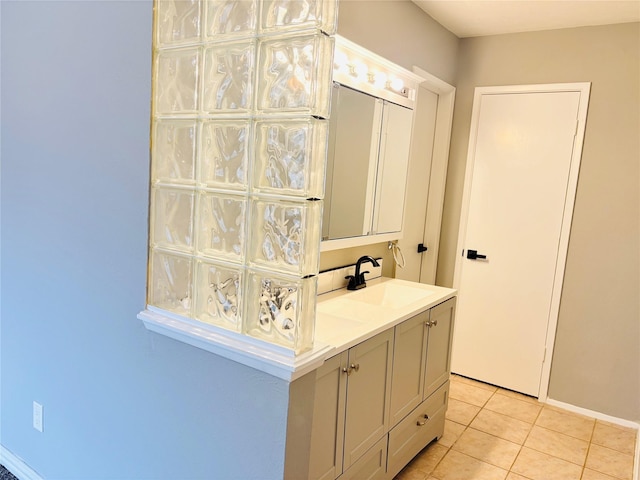 interior space with light tile patterned floors and sink